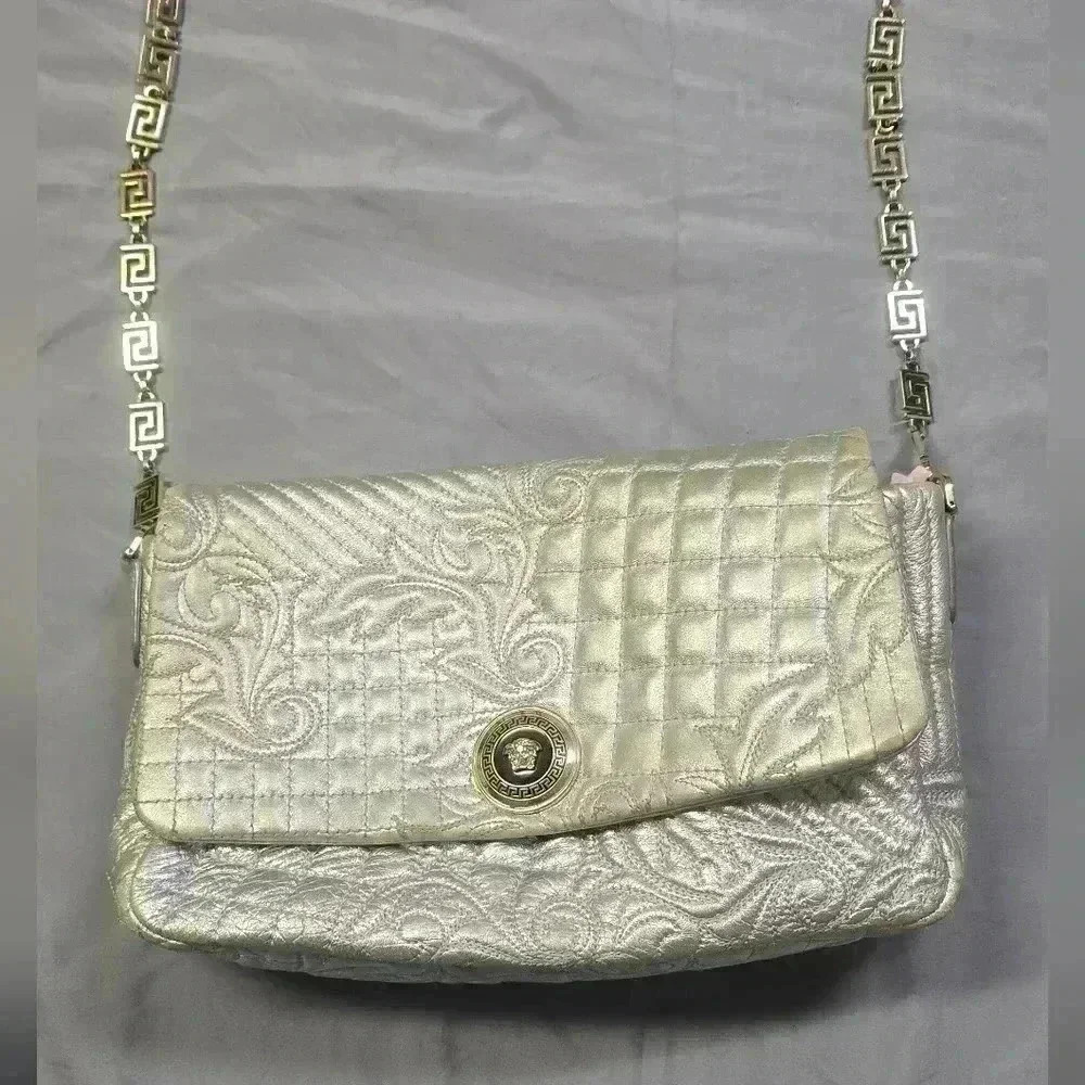 Metallic silver Versace purse great condition 8 by 12 inches